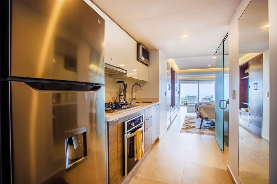 The well equipped kitchen includes a full size refrigerator, stove and oven