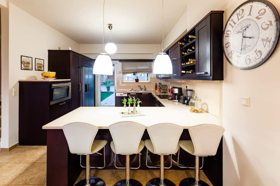 Spacious  kitchen dinning table, inviting for shared meals and delightful conversations