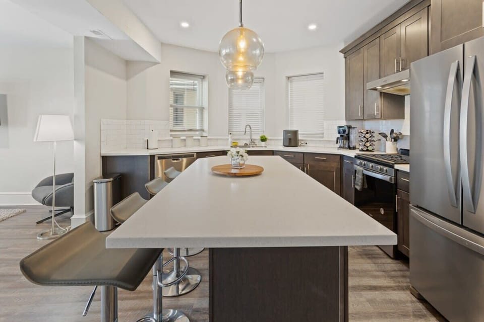 Designer kitchen with island in open concept living area