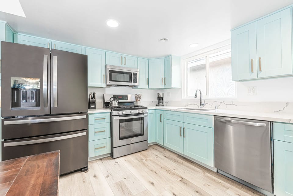 The kitchen comes stocked with dishes, utensils, cookware, bakeware, and small & large appliances.
                