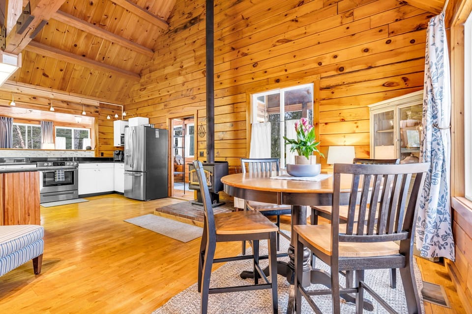 Open to the dining room, counter seating, and breakfast area facing the water