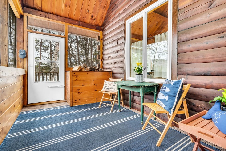 Screened-in porch off the kitchen leads to a deck and stairs for the lower yard.