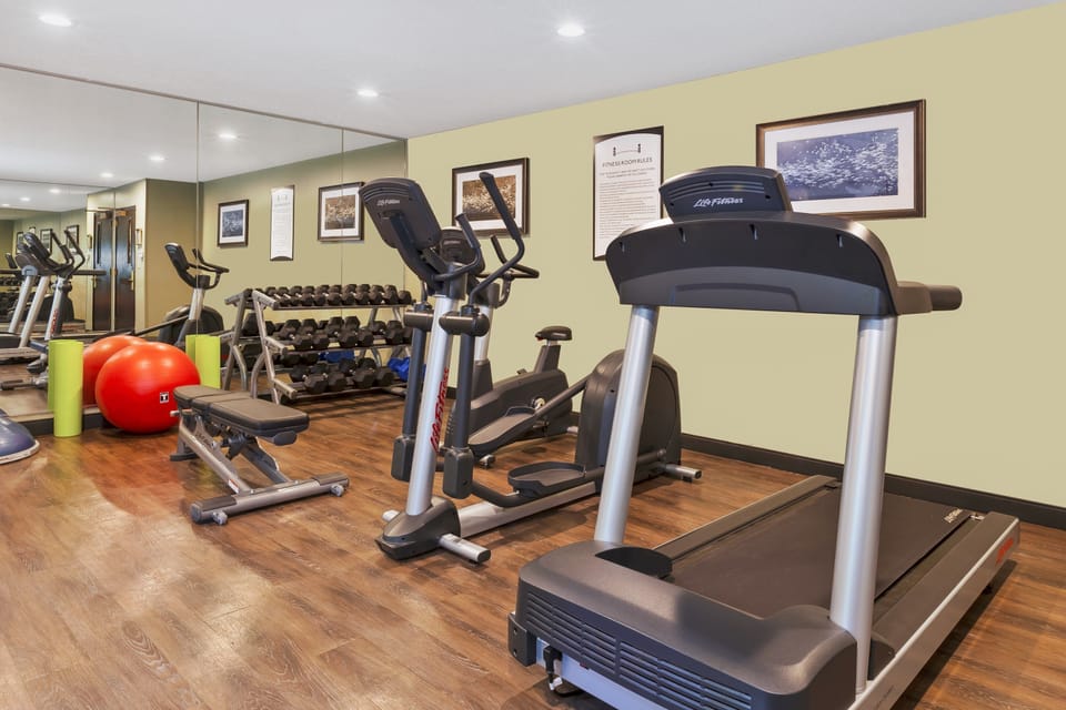 24-hour fitness center with cardio machines and free weights — no excuses on rest days