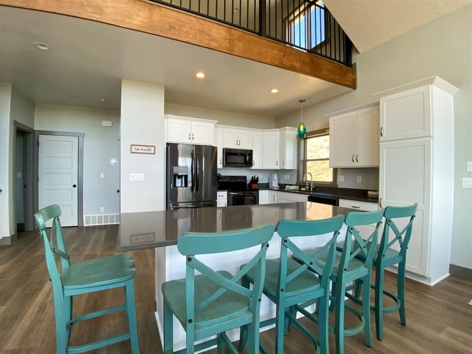 Gather around the spacious island in this bright, modern kitchen perfect for cooking and conversation.