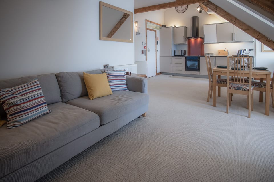Apartment (1 Bedroom) | Living area | 32-inch Smart TV with cable channels, TV