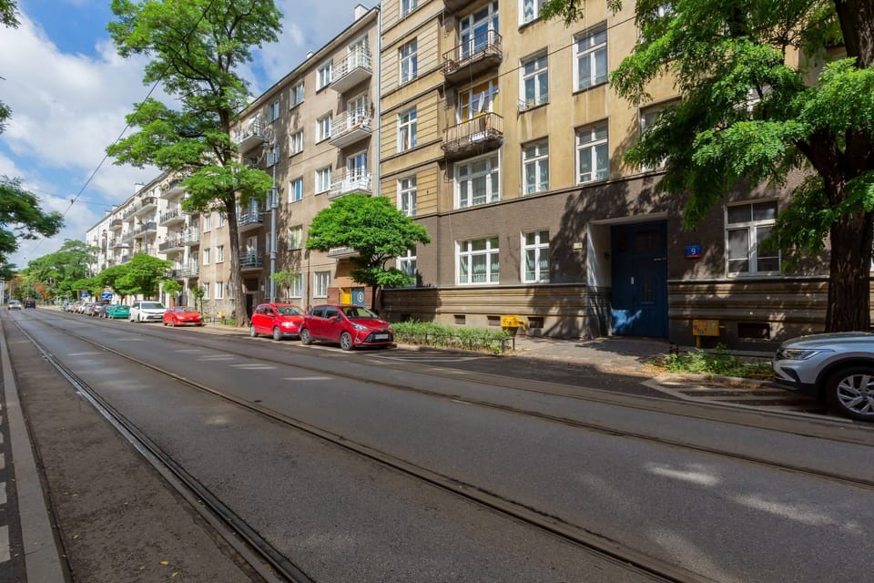 A wider street view with trees and parked cars, capturing the quiet neighborhood ambiance.