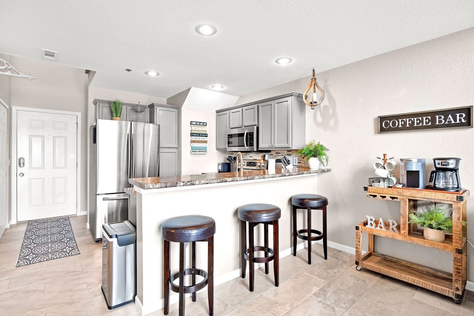 Breakfast bar with 3 stools. Coffee cart with keurig and regular drip coffee pot
