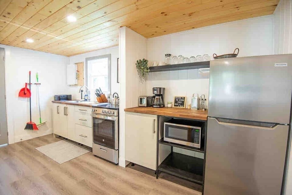 Kitchen with all the necessities including a waffle makes and baking trays  
