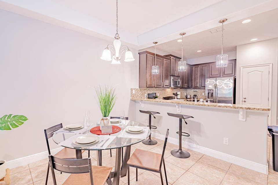 Dining Area Includes Table for 4 Nearest & Dearest and 2 Barstools
