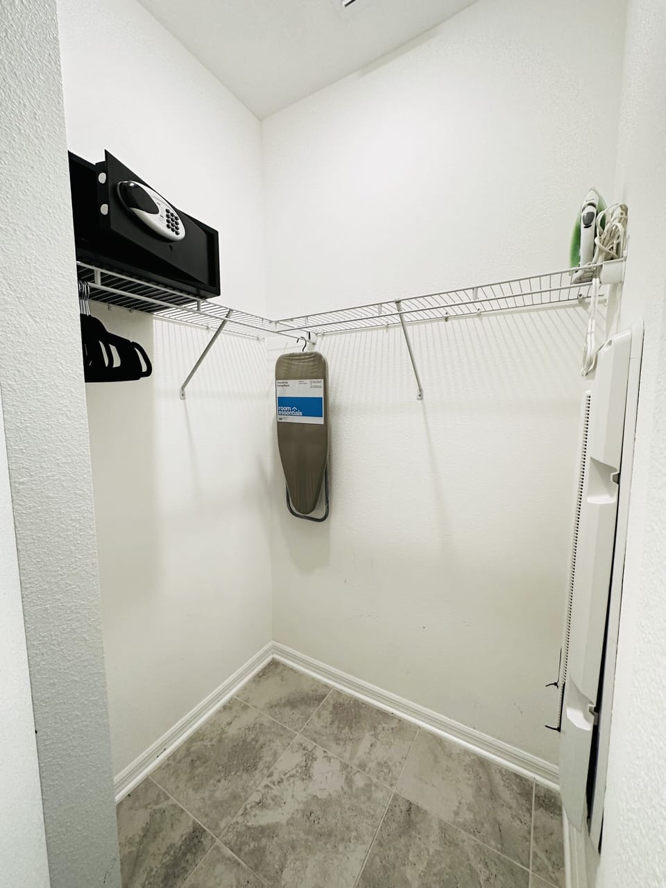 Safe, iron, and ironing board for your use.