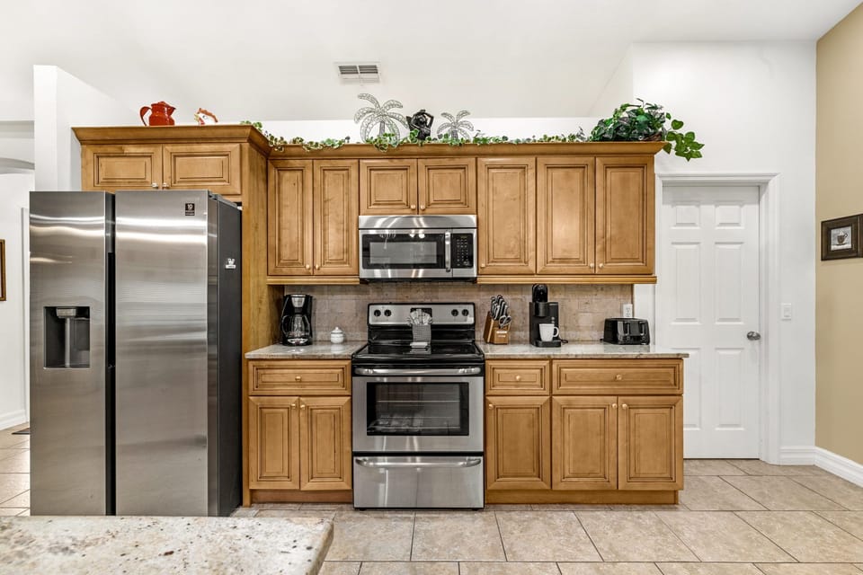 Fully equipped kitchen with stainless steel appliances