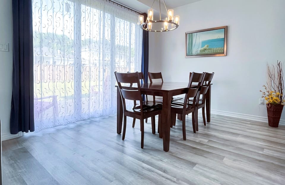 Bright dining area with a wide 10 feet patio door to the deck and backyard
