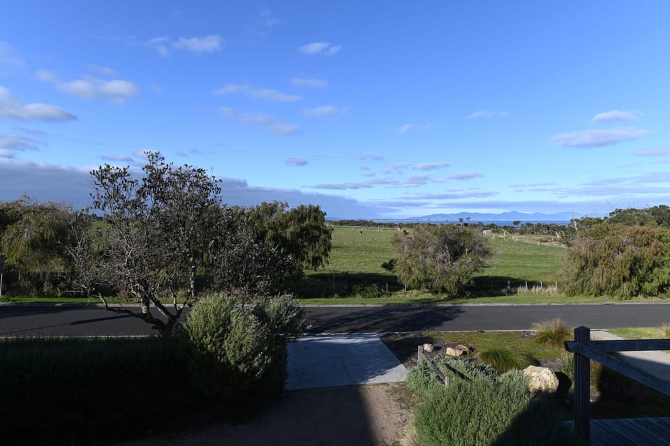 View from Deck over paddocks. Outlook to Wilson's Prom and Sandy Point.