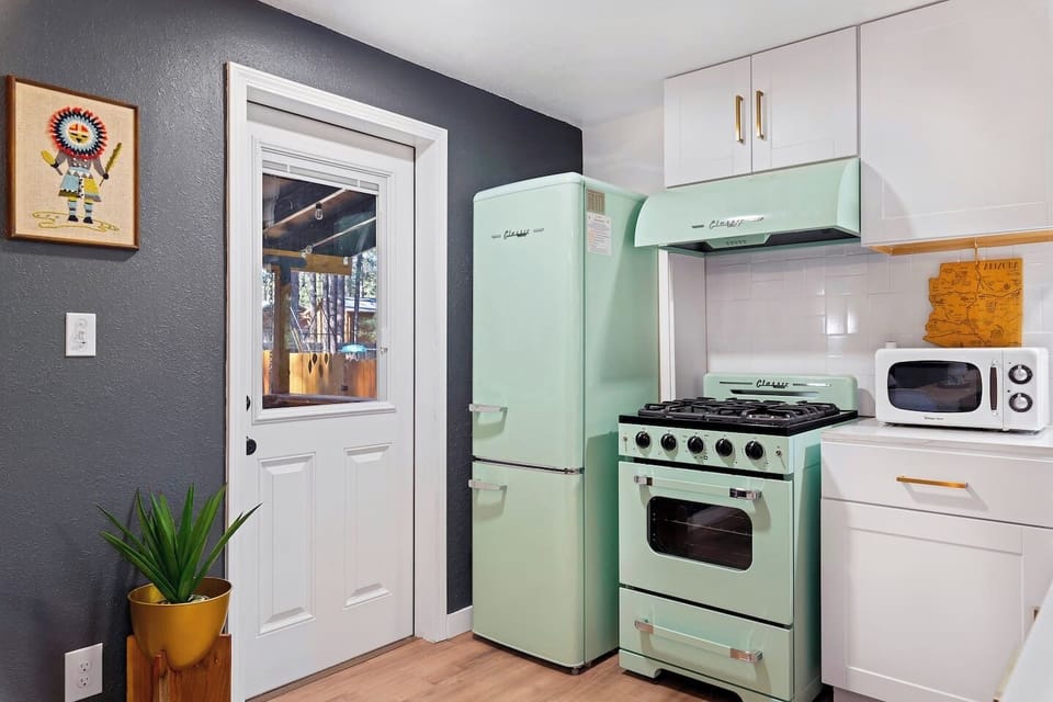 Kitchen exit to the back patio, bring your favorite cold beverage and let's sit and talk.