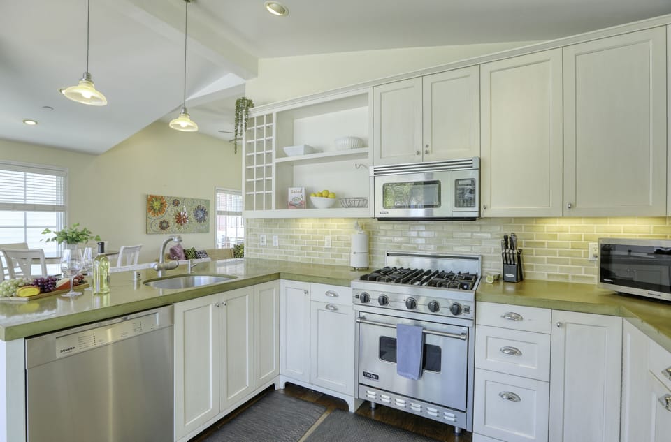 Stainless steel oven and appliances lend a hand to dining at home.