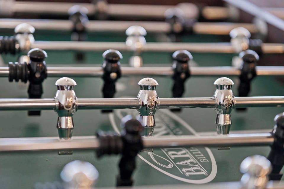 Enjoy some friendly competition with a full-size foosball table right in the living room perfect for guests of all ages.
