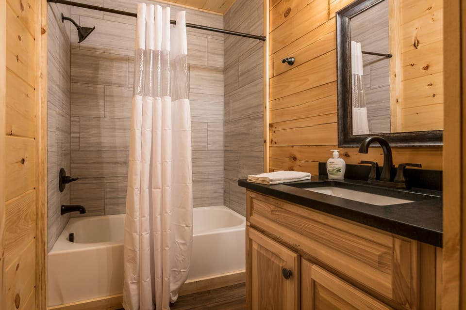 Main Level Shared Bathroom with combo tub/shower