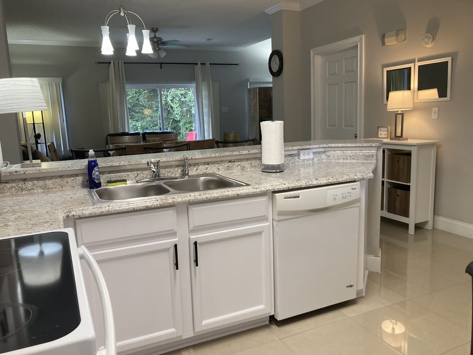Open concept Breakfast bar, so you can chat with your loved ones over meal prep.