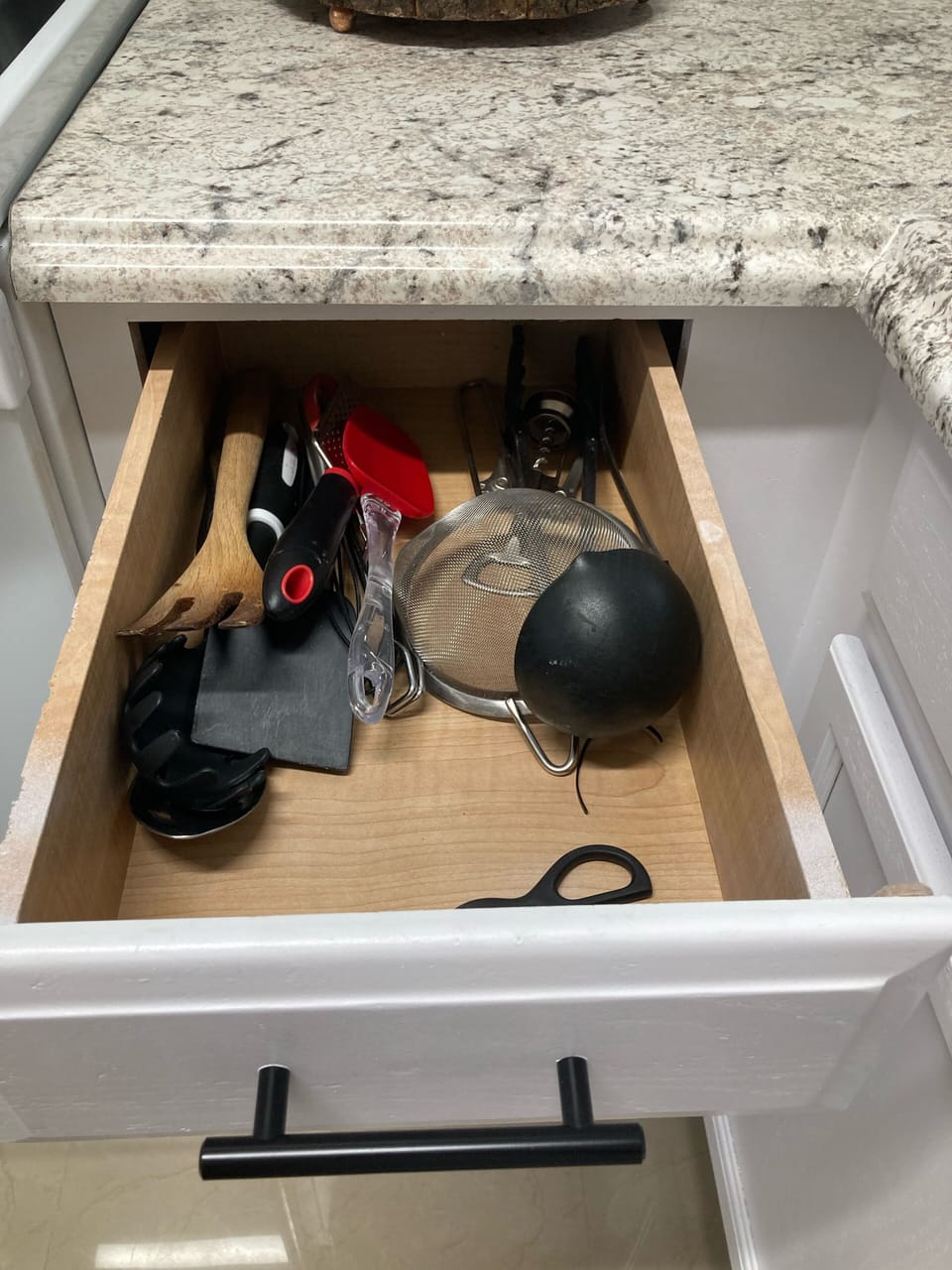 Kitchen is well stocked with basic supplies for cooking.