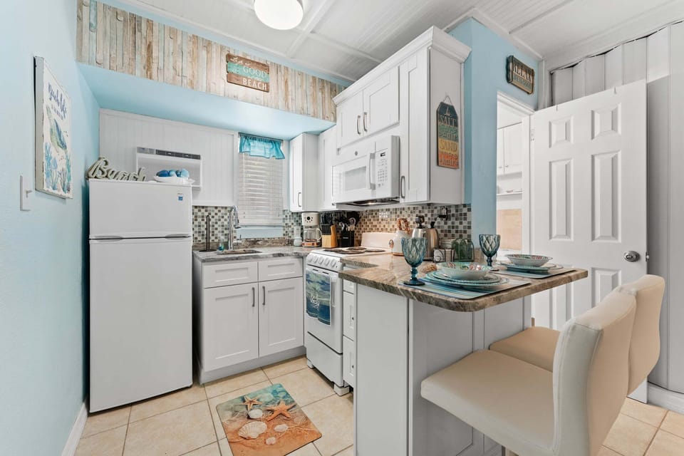 The efficient kitchenette is equipped with full size appliances for convenience