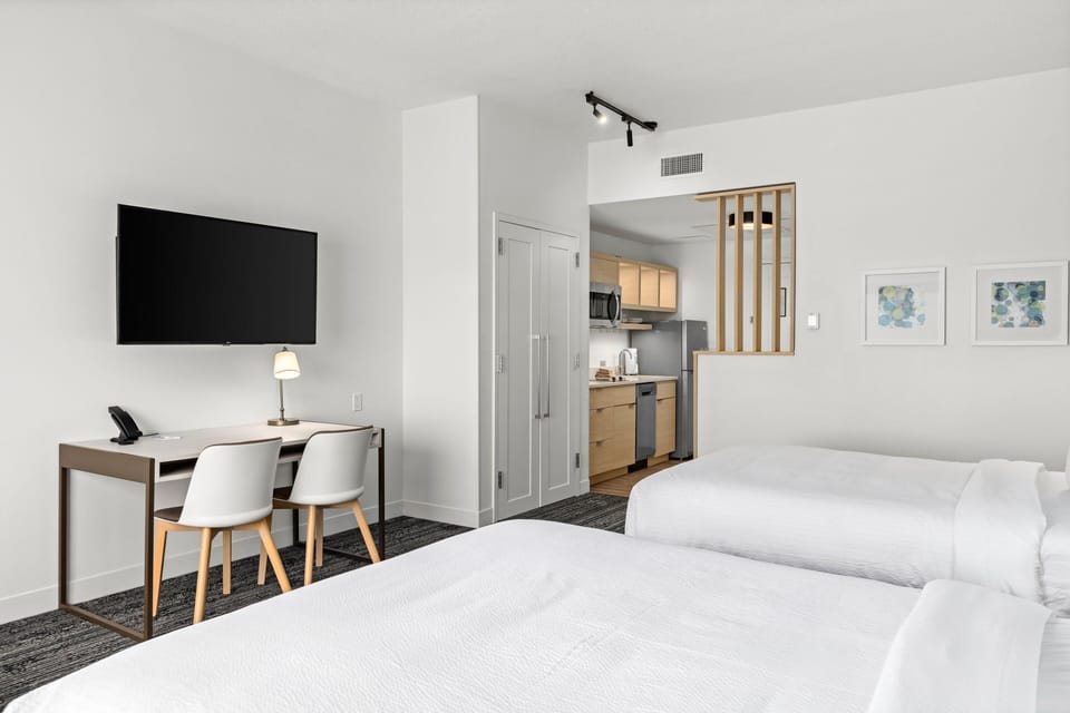 Premium bedding, laptop workspace, blackout drapes, iron/ironing board