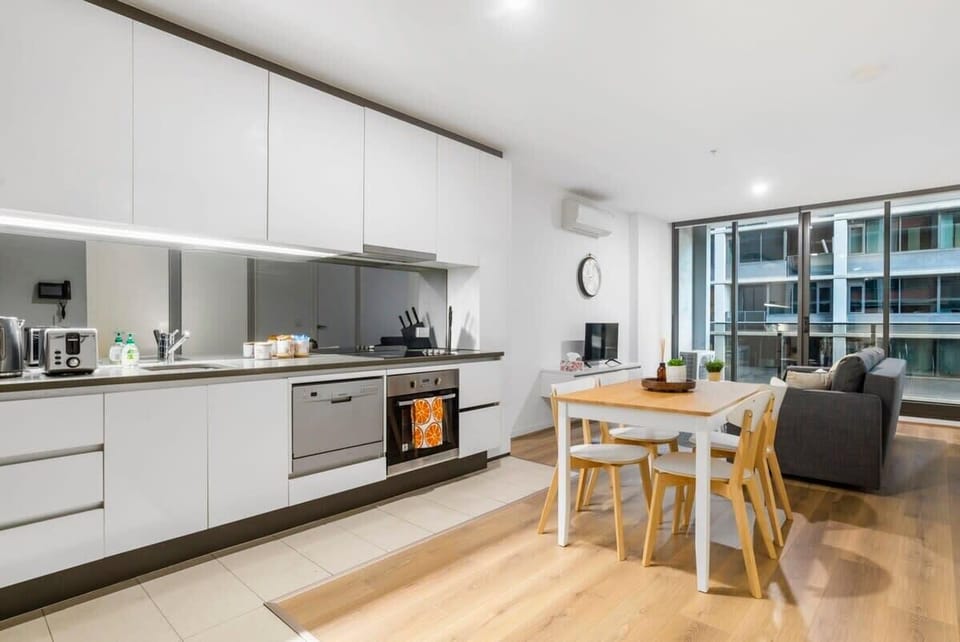 A fully decked kitchen & dining area.