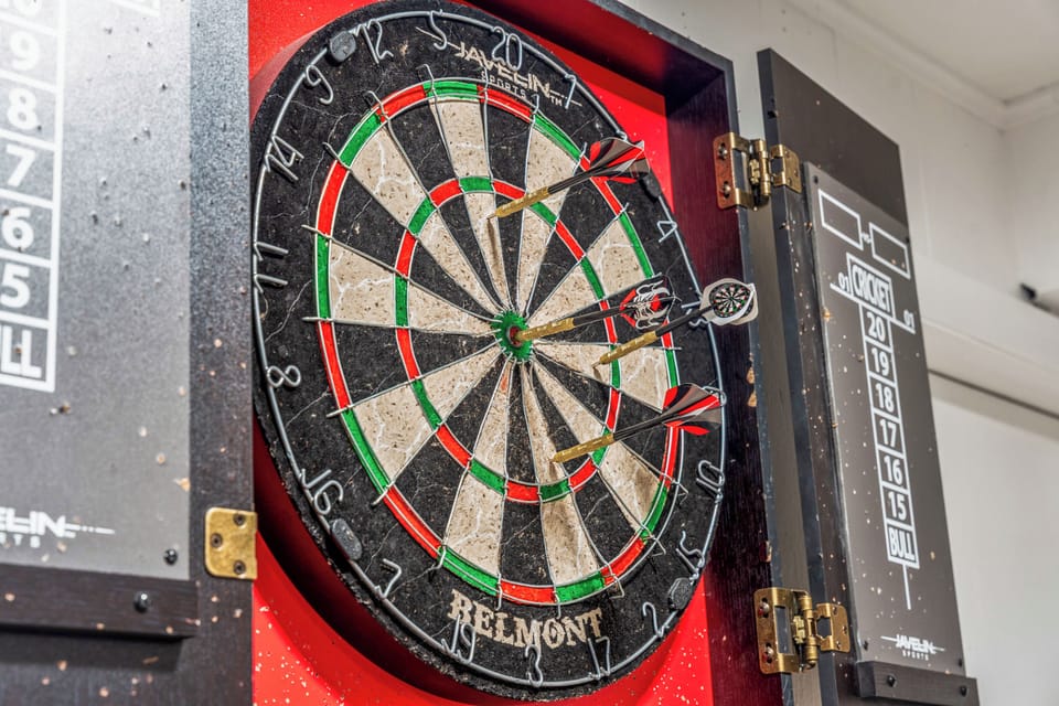 🎯✨ Bullseye Fun Zone ✨🎯 Step up to the dartboard and test your aim! Perfect for friendly competition, laughter, and laid-back hangouts in the ultimate game room retreat 🕹️🍻🏡