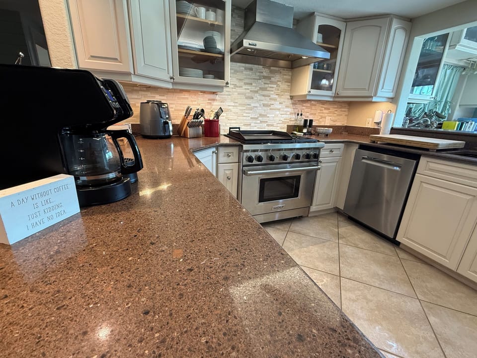 Kitchen boasts 2-year-old high-end appliances and a ceiling fan. 