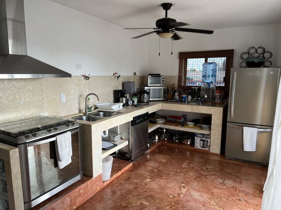 Kitchen area with Gas stove & Oven, dishwasher, full size fridge, microwave