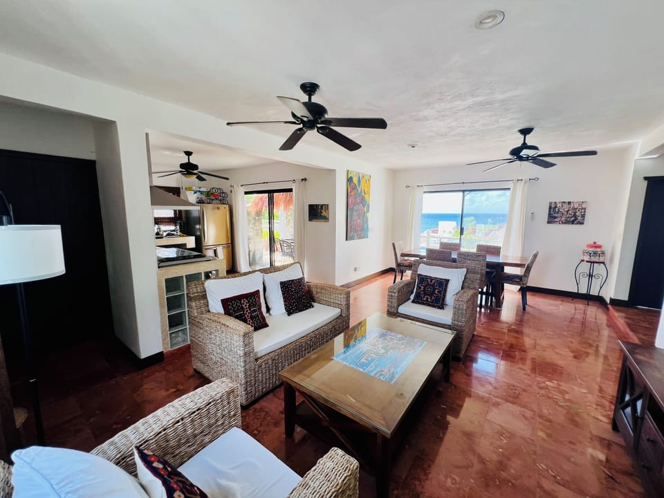 Living room area and adjoining kitchen area