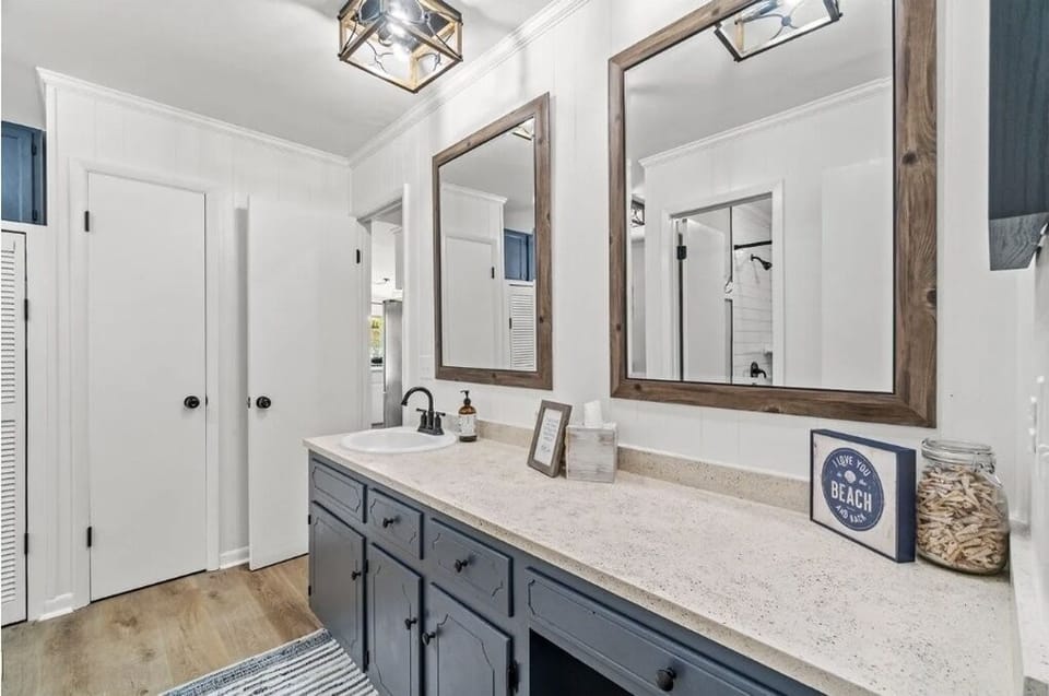 King bathroom sink area is separate from shower/toilet area for added privacy