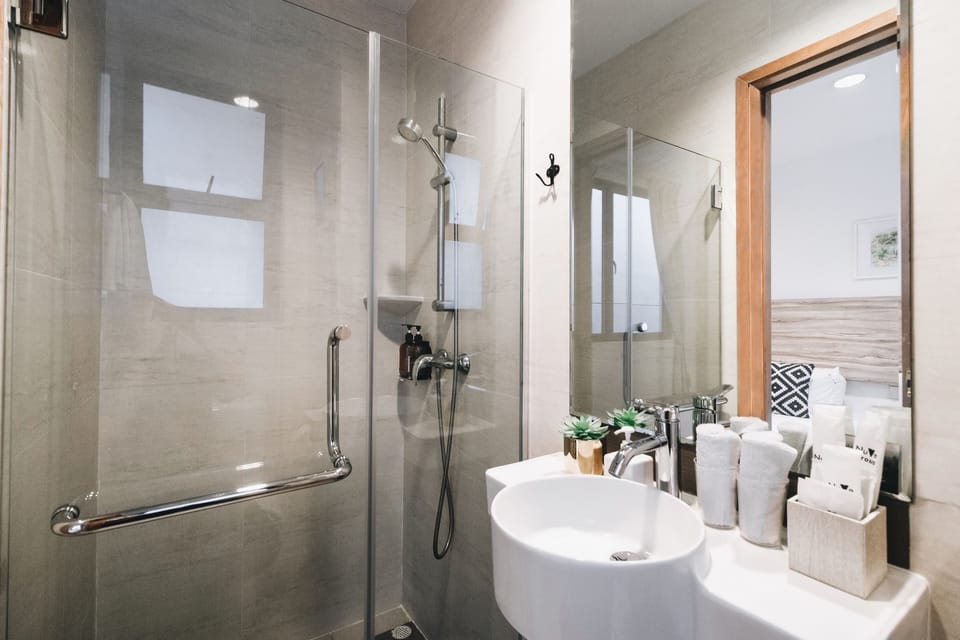 Shower, free toiletries, hair dryer, slippers