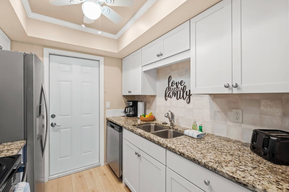 Stainless-steel appliances and granite counters—ready for home-cooked meals