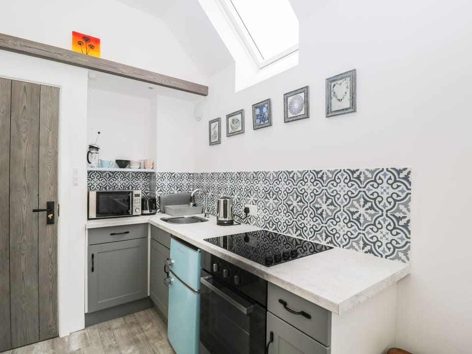 Fridge, electric kettle, toaster, cookware/dishes/utensils