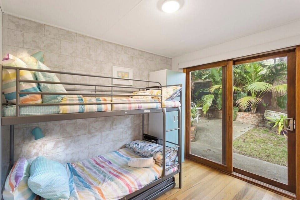 Bedroom 3, Bunk beds for the kids, with access to backyard area.