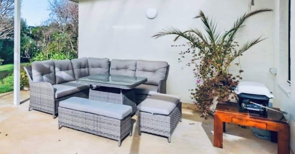 The north-facing patio with BBQ and outdoor furniture is undercover for all-weather use