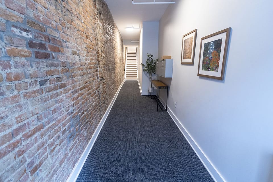 Front lobby of the building. These steps go up to the second floor unit.