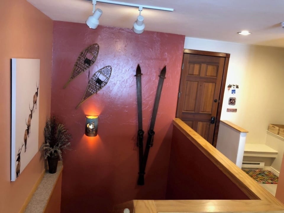 The stairs to the bottom floor and the door you just walked in.