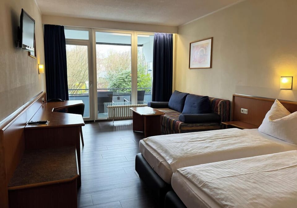 Family Room, Balcony | In-room safe, desk, soundproofing, free WiFi