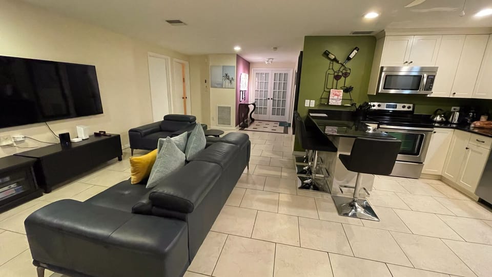 Living area onlooking main entrance door and bedroom #3