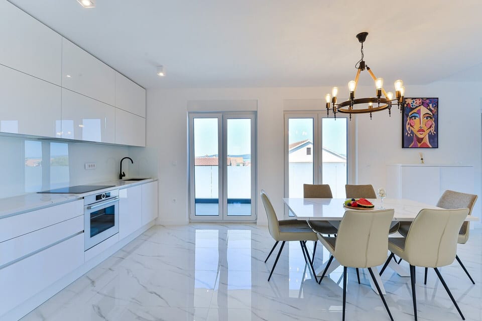 Beautiful open concept living area with exit to the balcony