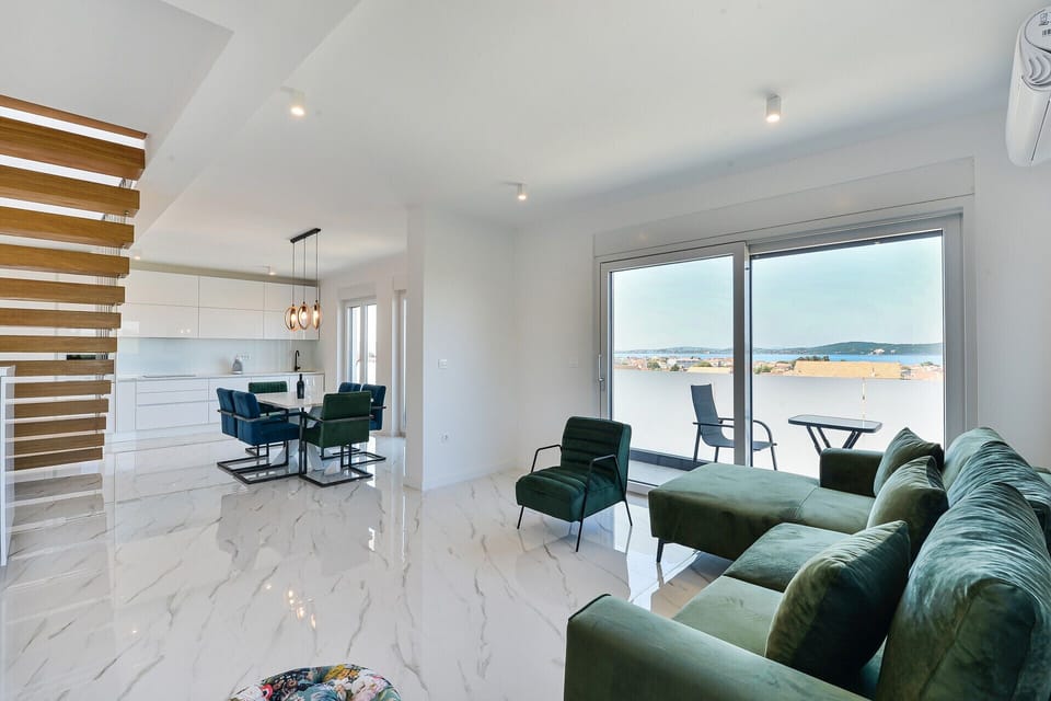 Beautiful and spacious living area with exit to the balcony and rooftop sun terrace