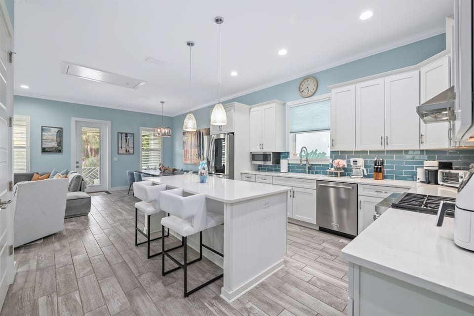 Bright, open kitchen and living area designed for cooking, gathering, and relaxing together.