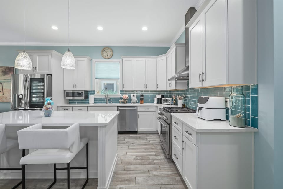 Bright, fully stocked kitchen with modern finishes and everything you need for easy meals.