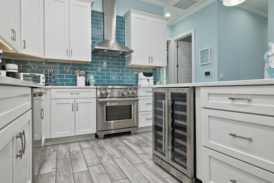 Gourmet kitchen with Wolf gas range, wine fridge, and everything you need for easy entertaining