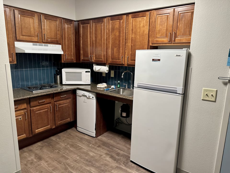 Fully equipped kitchen with appliances and generous storage.