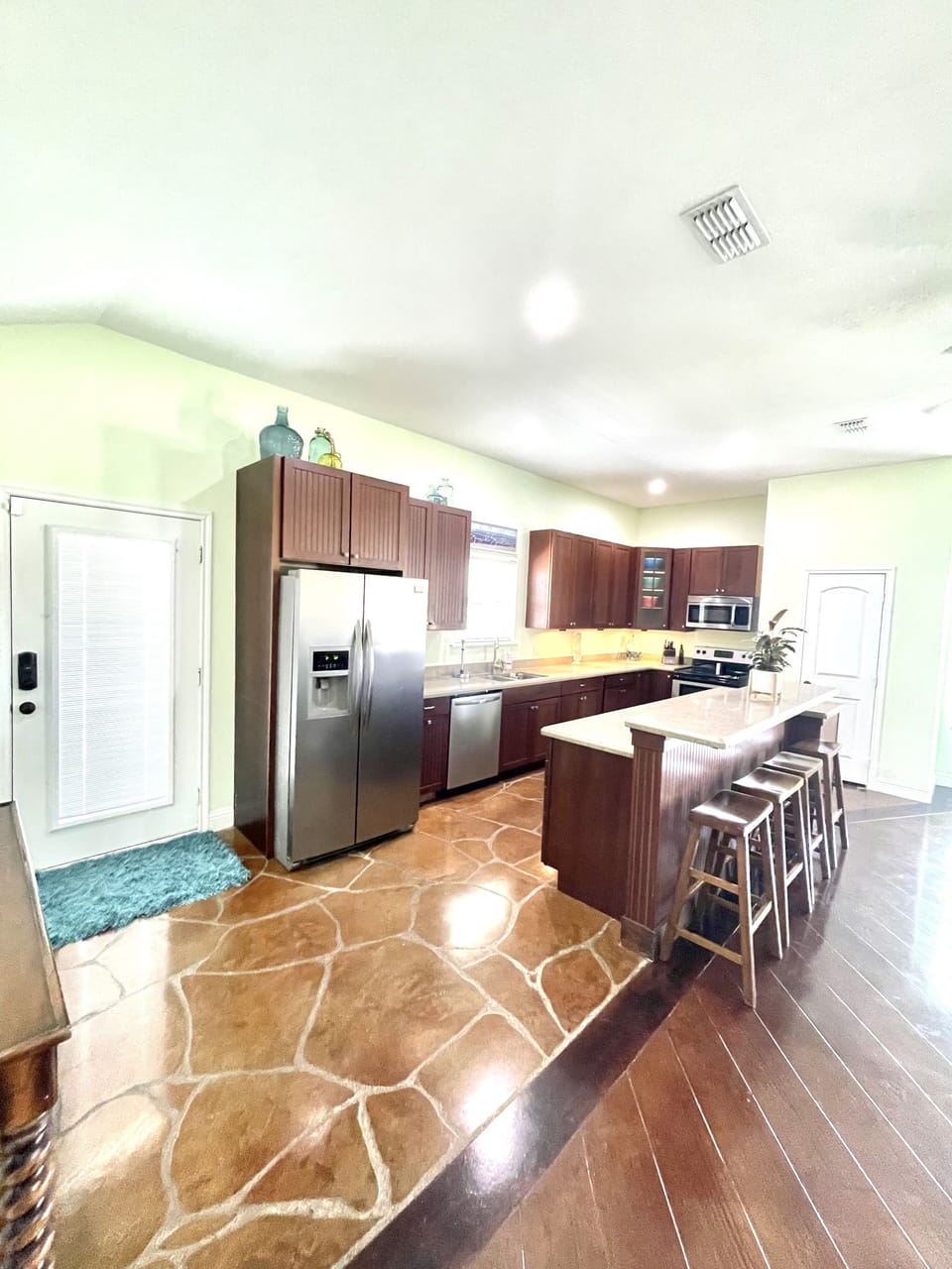 kitchen with side door to additional patio.
