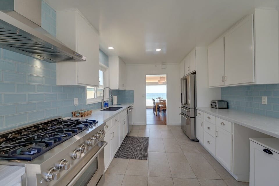 The kitchen at Blue Sea Villa is stocked with everything you need to prepare a meal at home! The 6 burner stove top and double ovens are perfect for preparing meals for large groups!