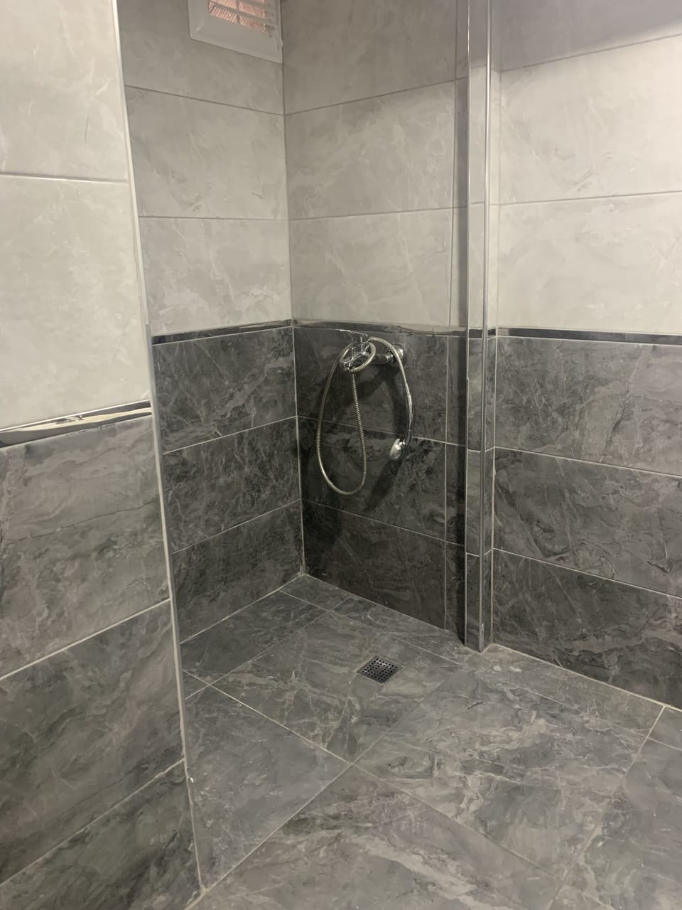 Economy Quadruple Room | Bathroom | Shower, rainfall showerhead, hair dryer, towels