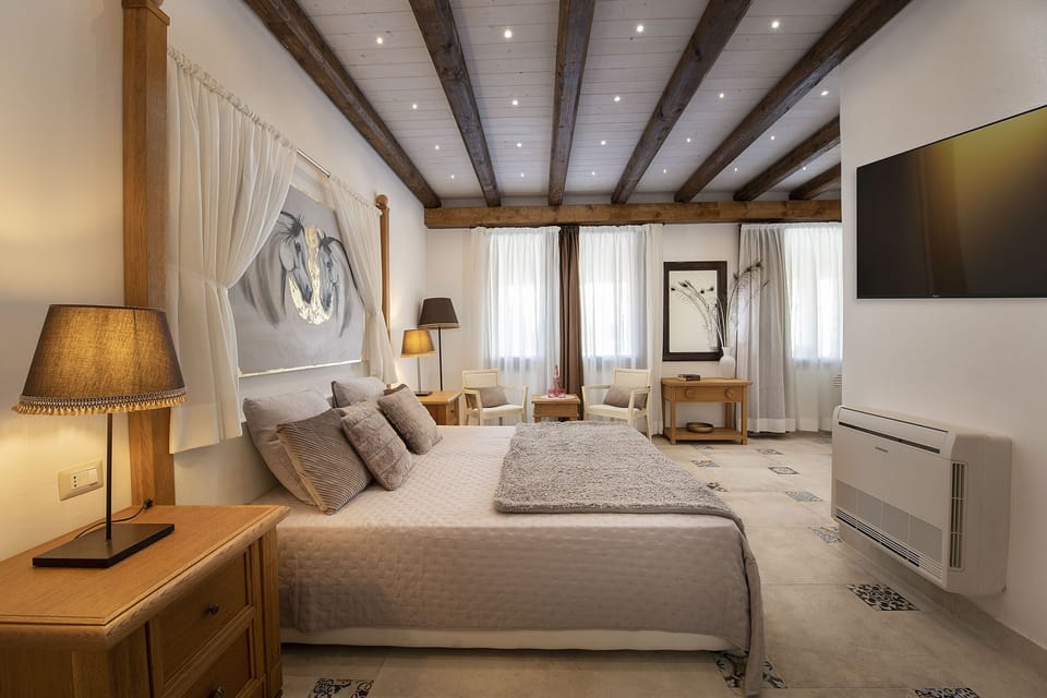 Family Room, 2 Bedrooms, Courtyard Area | Minibar, in-room safe, individually decorated, individually furnished